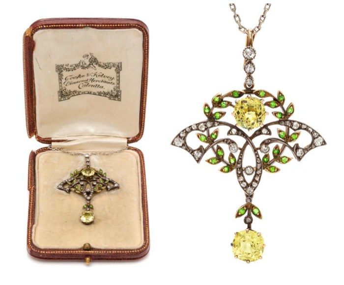 A silver-topped gold, yellow sapphire, demantoid garnet, and diamond pendant necklace by Cooke & Kelvey, Calcutta.