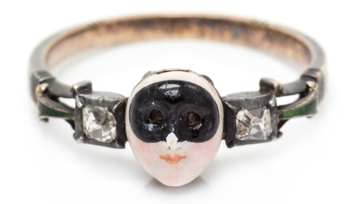 A rare 18th century Carnival mask locket ring. This treasure features a secret compartment and the message 'SOVS LE MASQVE LA VERITE' which means 'Under the mask, the truth.'