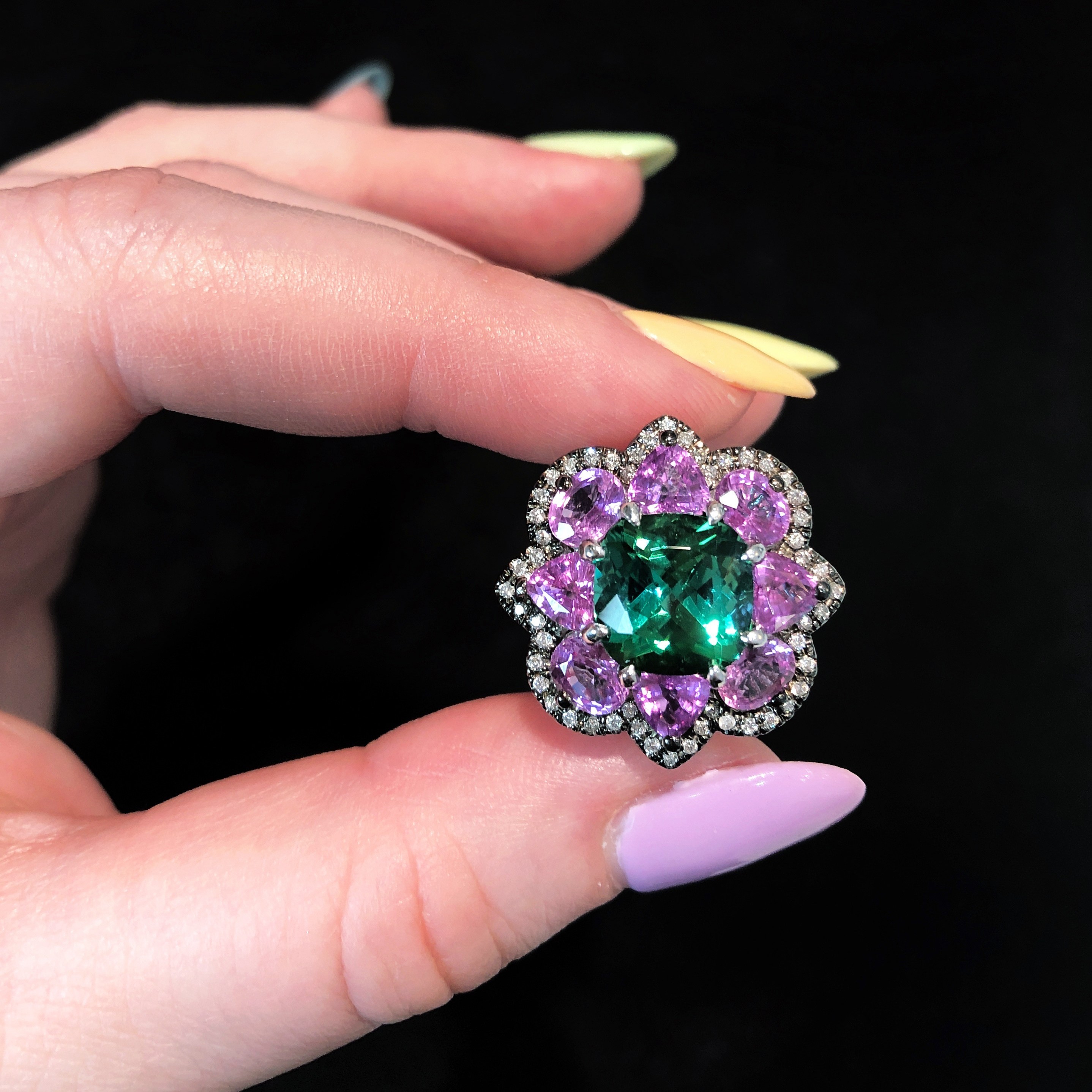 A beautiful tourmaline, sapphire, and diamond ring by Campbellian Collection. Spotted at AGTA GemFair 2019.