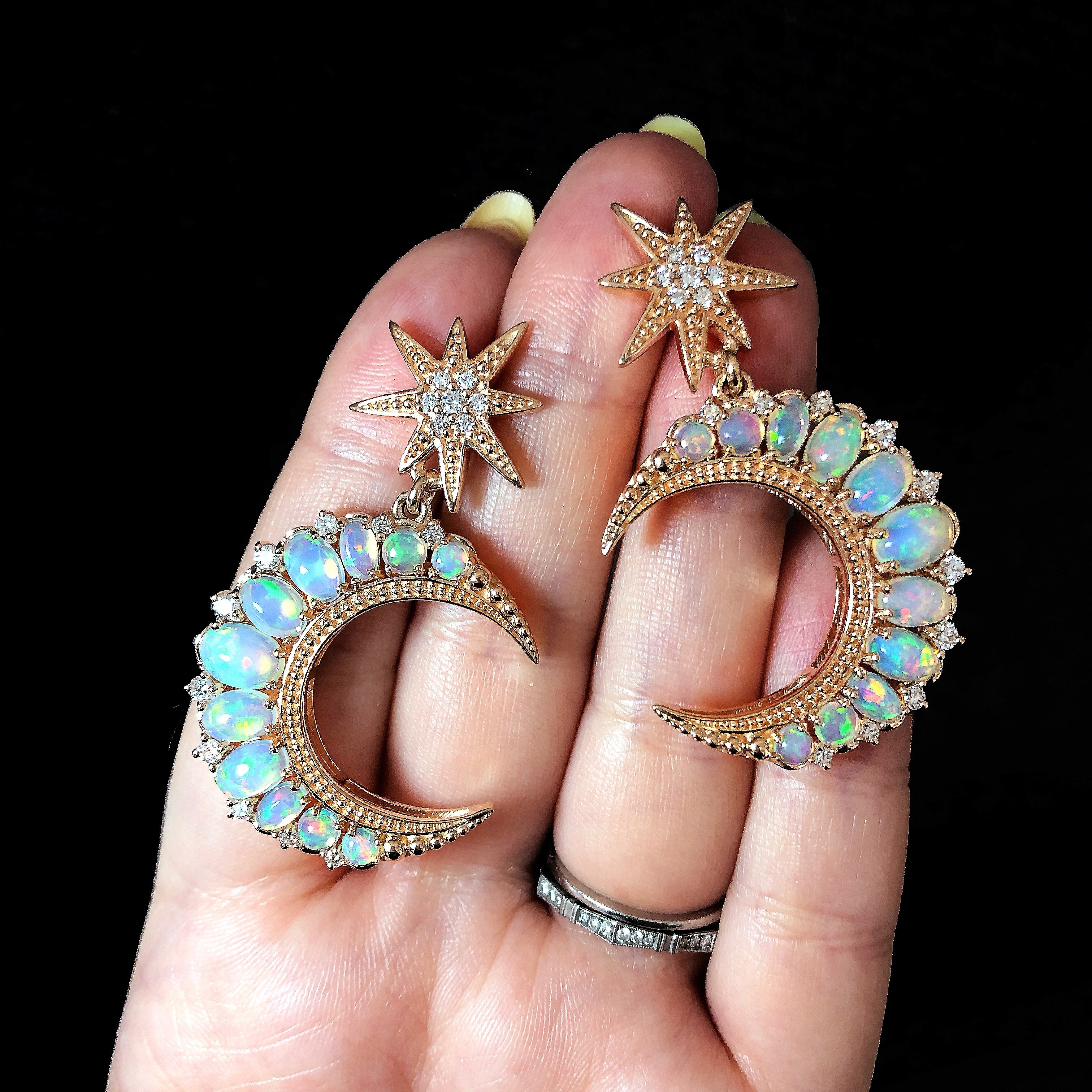 I love these rose gold and opal crescent moon earrings by Dallas Prince Designs.