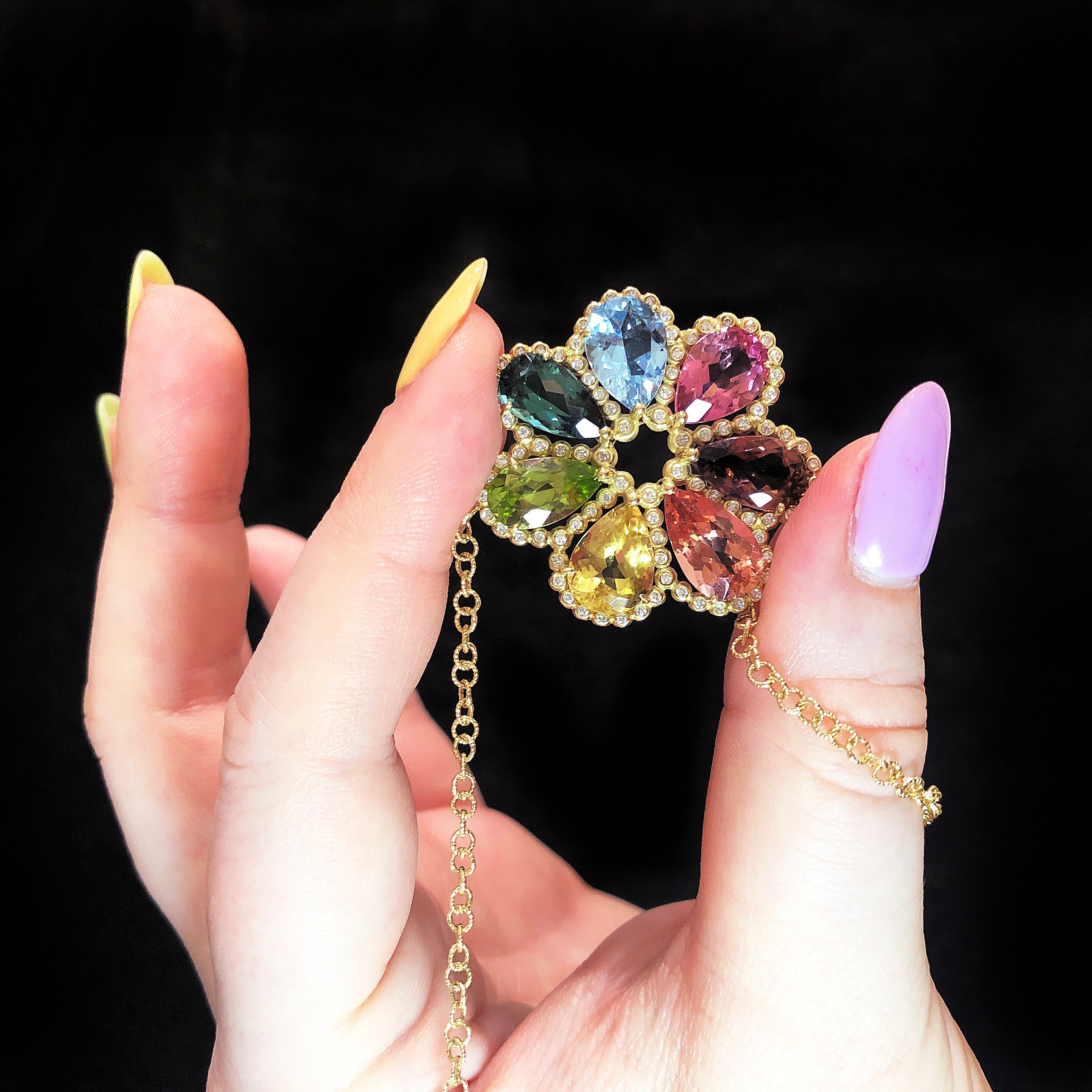 I love this rainbow pendant from Suzy Landa! Gemstones in gold with diamonds.
