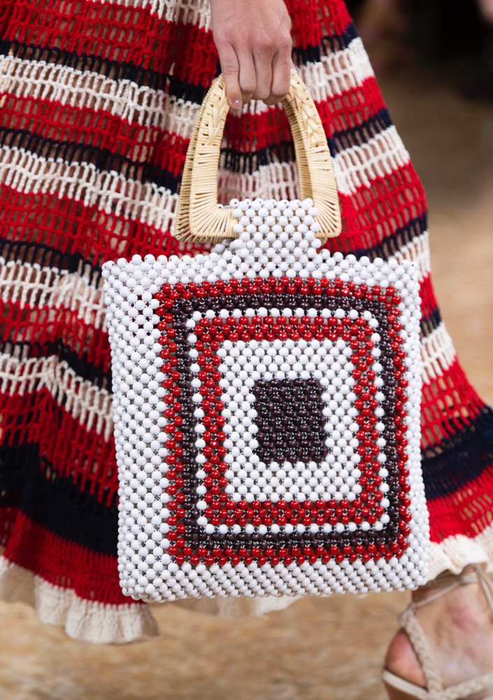 A beaded bag on the runway.