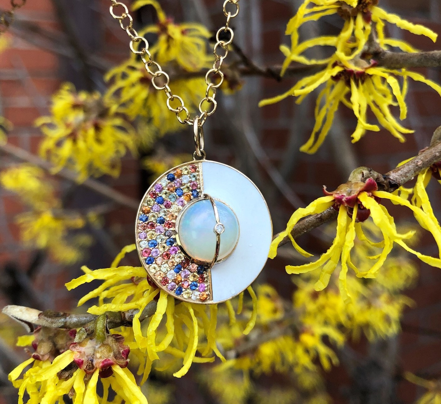 I love this rainbow necklace from Loriann Jewelry's new Unity Collection! Colorful sappphires, white enamel, and a beautiful opal in gold.