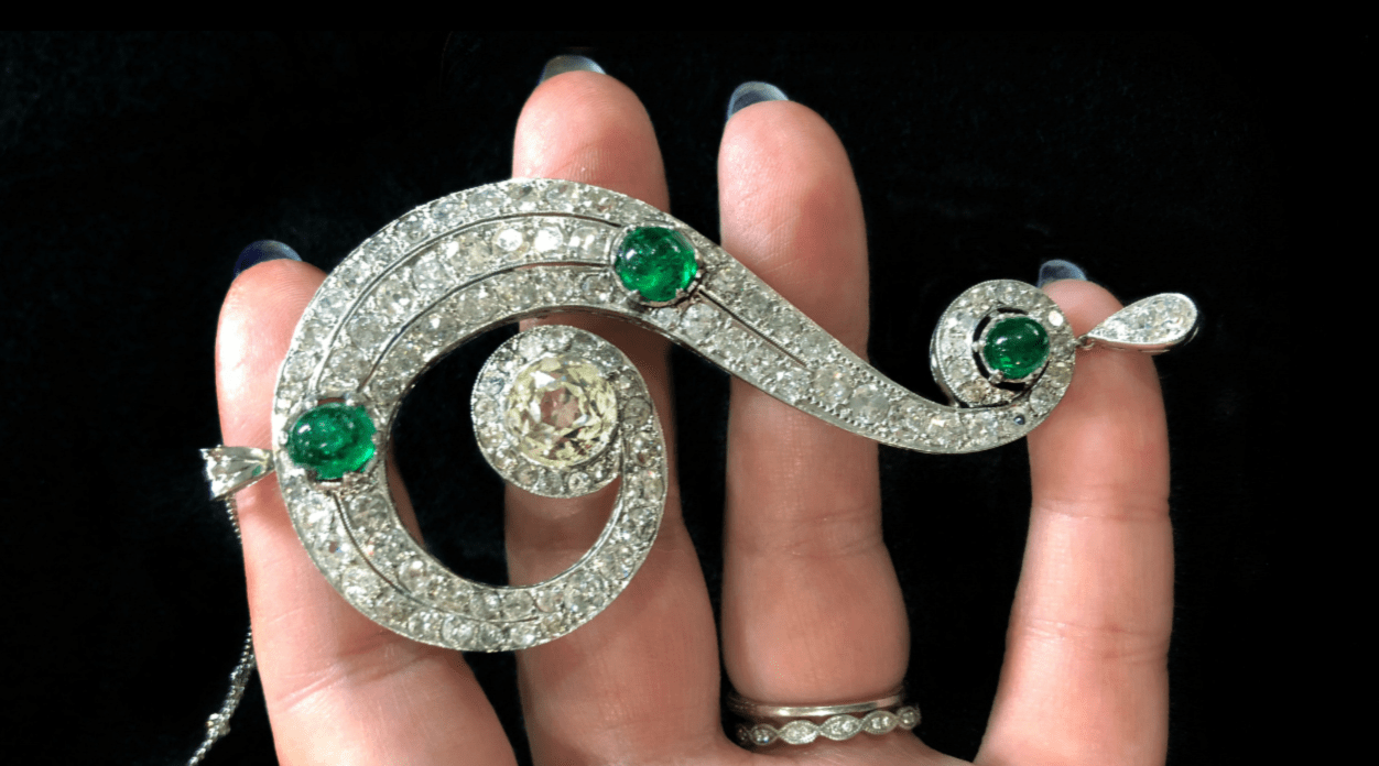 This is a magnificent Art Deco era emerald and diamond question mark necklace, from Pam Benson.