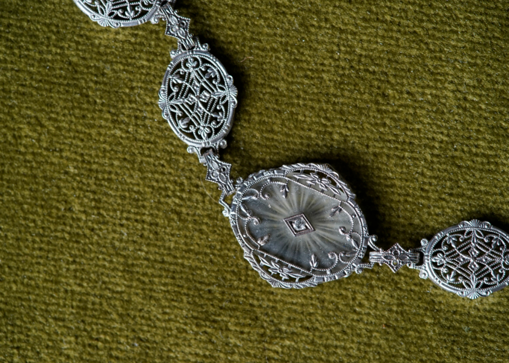 I love the beautiful details on this Art Deco era camphor glass and white gold filigree bracelet.