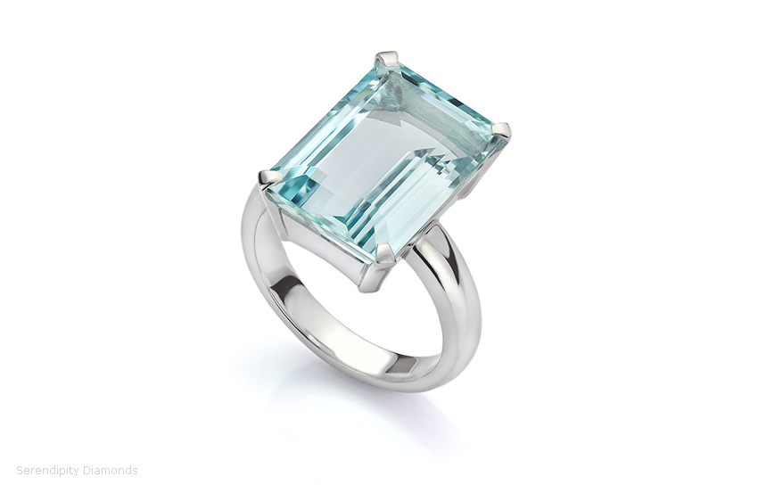 Bespoke ring featuring a solitaire Emerald cut Aquamarine